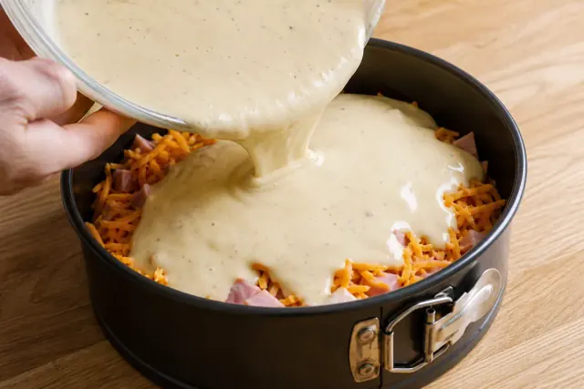 Remaining batter poured over the ham and cheese filling