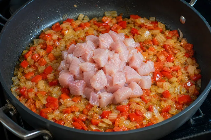 Chicken cubes added to the centre of the vegetables