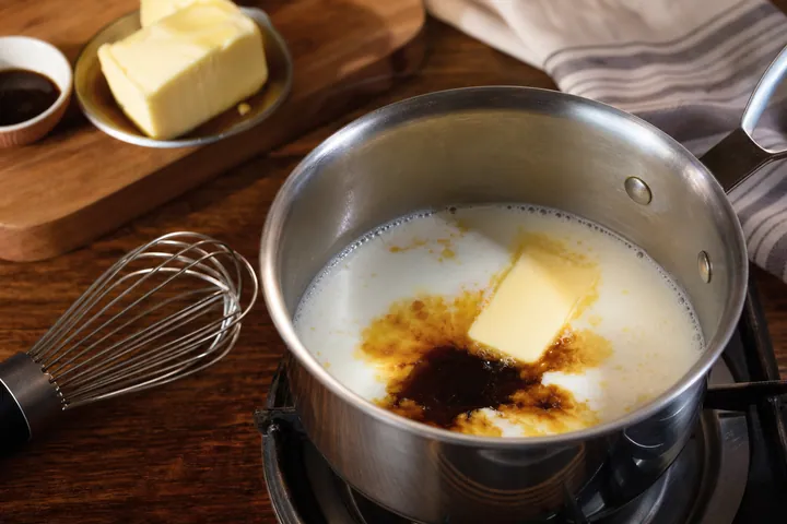 Milk, butter, and molasses warming in a saucepan