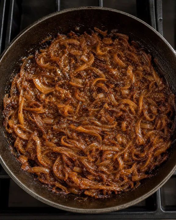 Deeply caramelized onions in a skillet