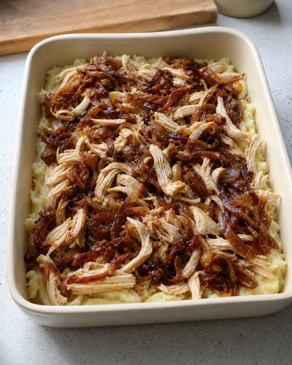 Chicken and caramelized onion over the potato base