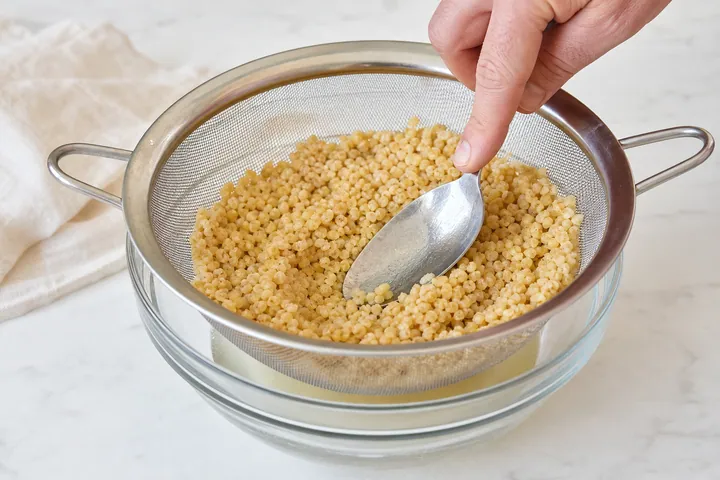 Cooked bulgur drained and pressed in a fine colander