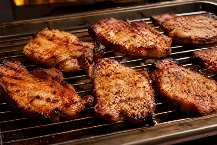 Golden grilled pork with charred edges