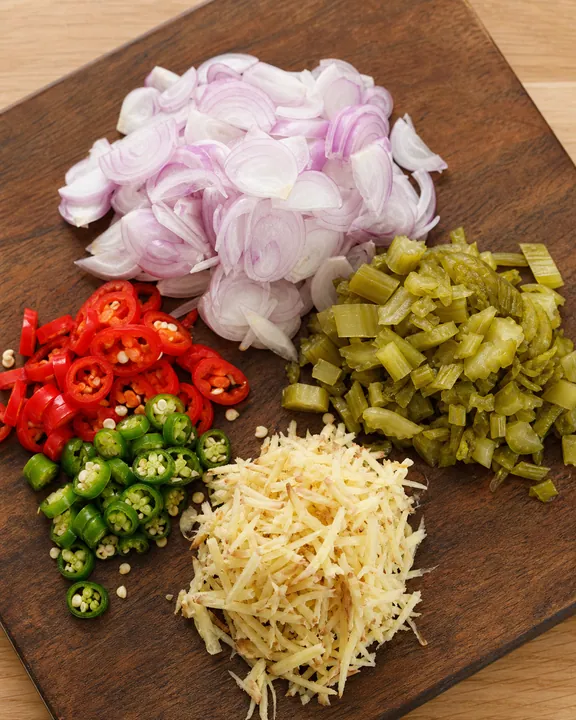 Chopped shallots, chilli, pickled onion, and galangal