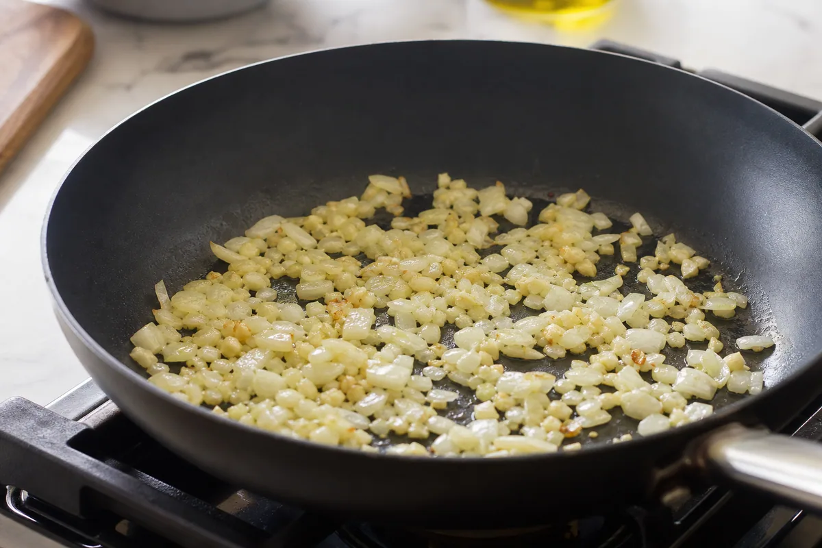 Chopped onion and minced garlic sautéing in olive oil